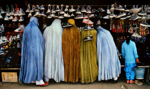 Women shoppers dressed in the tradional burqa, Steve Mccurry 